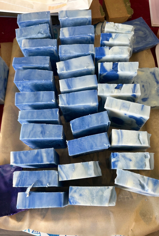Blue and cream handmade Endless Summer soap bars arranged in a batch.